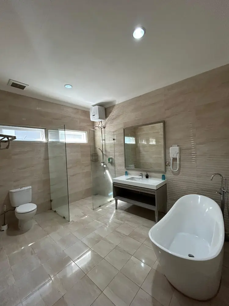 Bathroom with a freestanding bath and vanity at Marseillia Hills