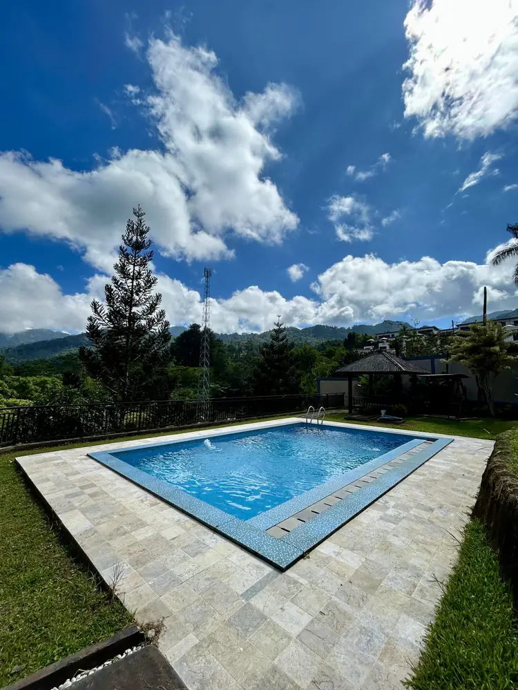 Private pool with a stone deck and mountain views at Al Andalus Resort