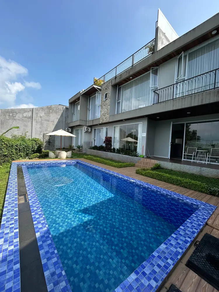 Long blue-tiled private pool along the villa at Armada Resort