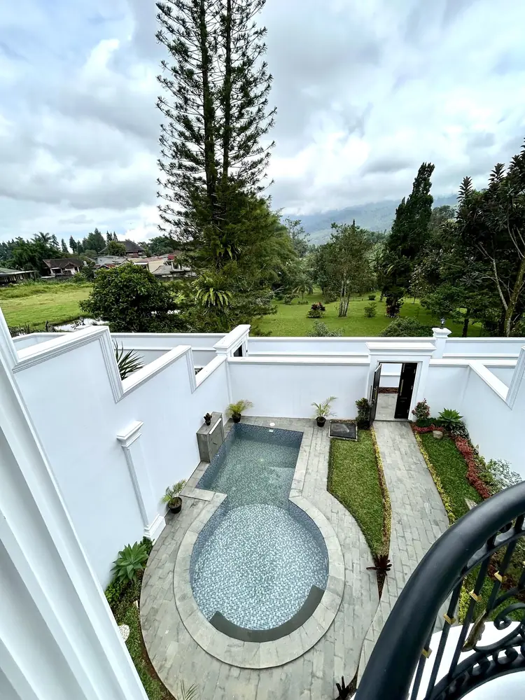Round private pool in a white walled courtyard at Classic Resort