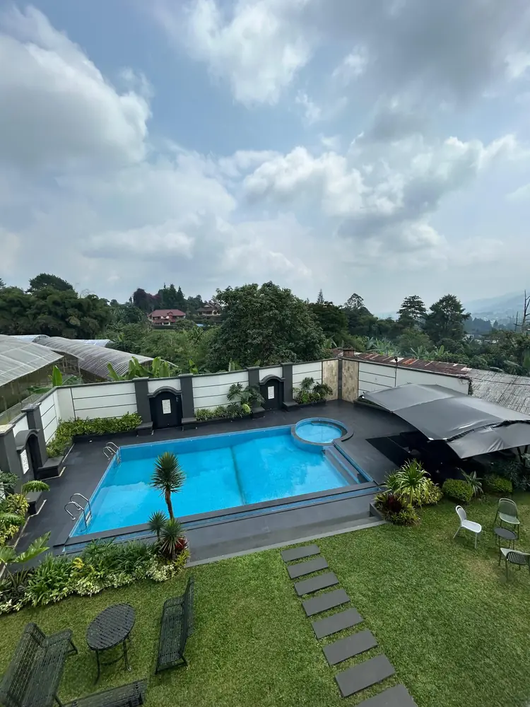Private pool and garden below the forested hills at Divan Hills