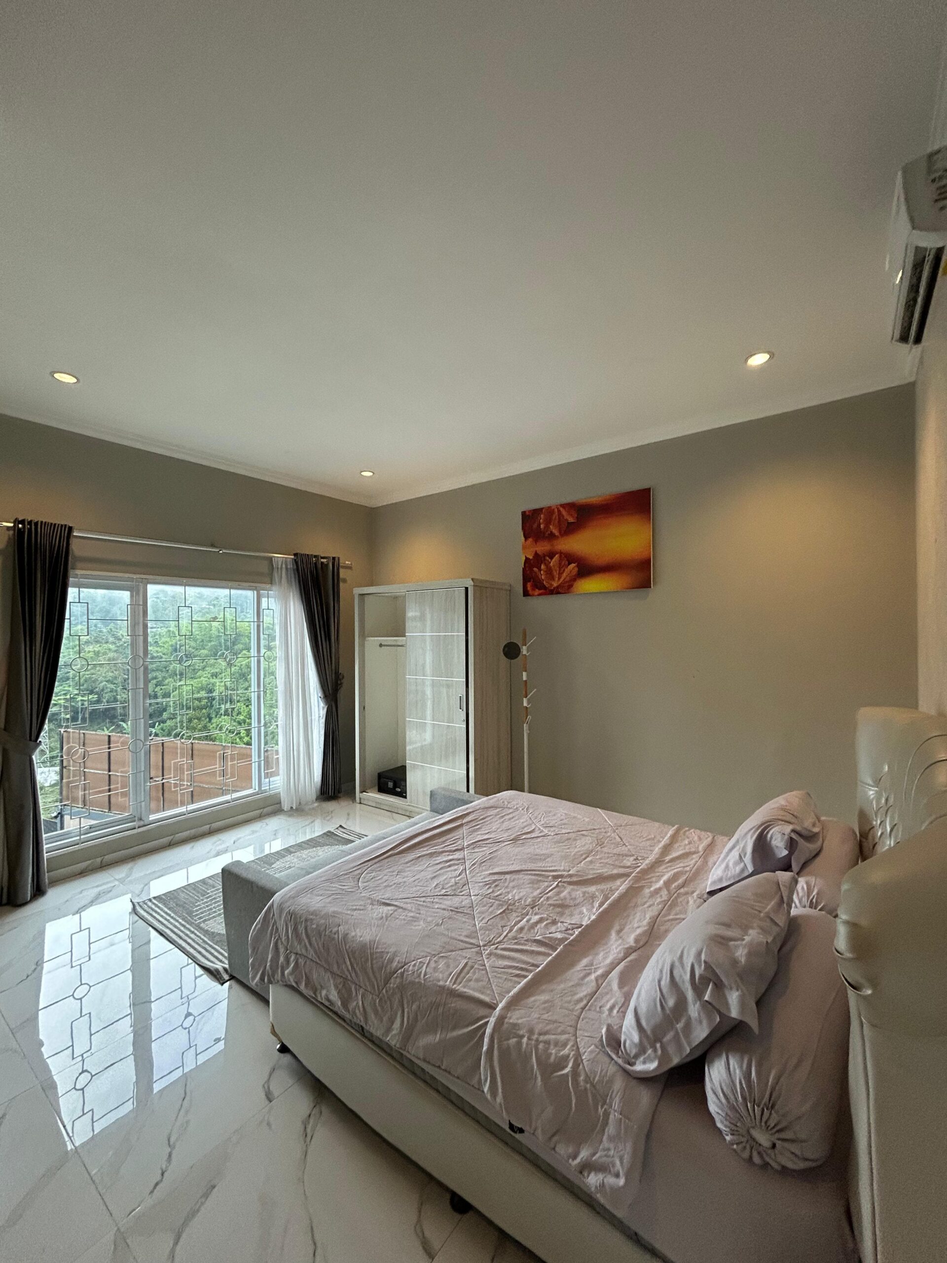 King bed with marble floor at Al Andalus Resort