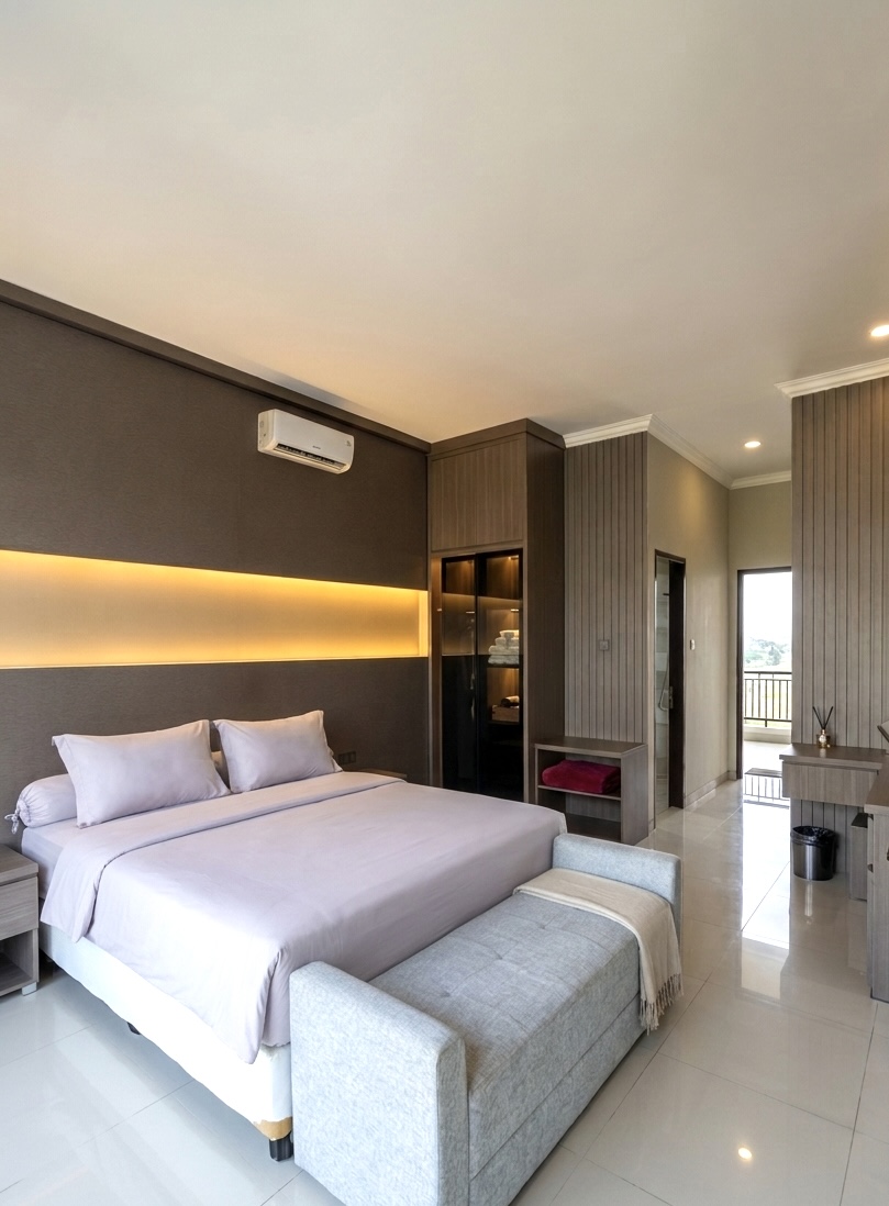 King bed with bench seat and dark accent wall