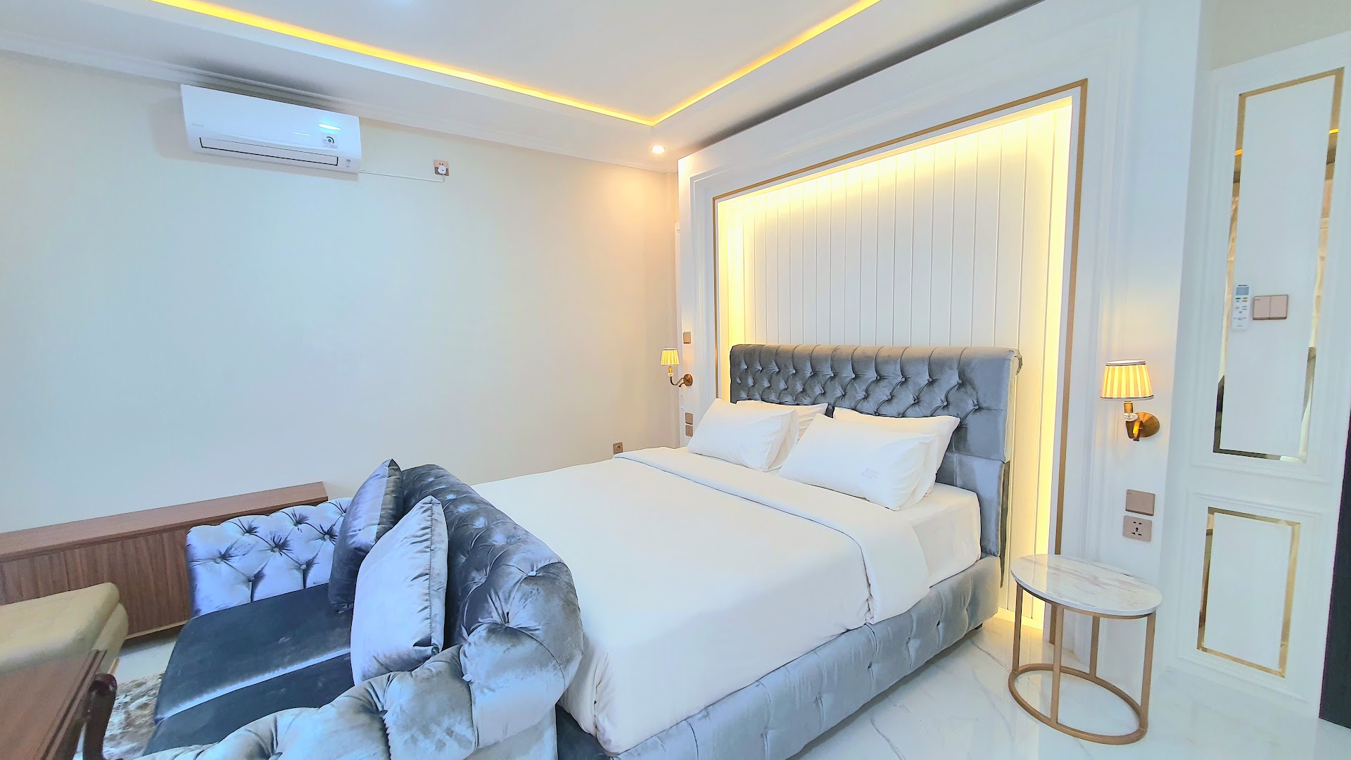 Bedroom with grey tufted headboard, Al Andalus Royal Puncak